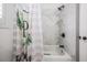 Stylish bathroom with marble tile surround shower-tub combo at 19223 Wind Dancer St, Lutz, FL 33558