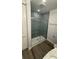 Bathroom with tiled shower, modern fixtures, and updated finishes in a bright and clean space at 2022 Camelot Dr # 9, Clearwater, FL 33763