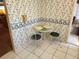 Cozy breakfast nook with tiled floor and wallpaper at 205 Dogwood Cir # 205, Seminole, FL 33777