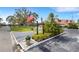 Community entrance with manicured landscaping and signage at 205 Dogwood Cir # 205, Seminole, FL 33777