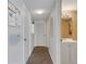 Hallway with wood floors and access to the bathroom at 205 Dogwood Cir # 205, Seminole, FL 33777