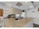 Functional kitchen features countertop and cabinets at 205 Dogwood Cir # 205, Seminole, FL 33777