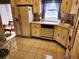 Kitchen featuring tile flooring, white cabinetry and classic appliances at 205 Dogwood Cir # 205, Seminole, FL 33777
