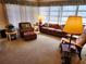 Cozy living room with seating arrangements and large window providing natural light at 205 Dogwood Cir # 205, Seminole, FL 33777