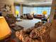 Bright living room with large windows and comfortable seating arrangements at 205 Dogwood Cir # 205, Seminole, FL 33777