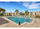 Community pool with lounge chairs and well-maintained landscaping at 205 Dogwood Cir # 205, Seminole, FL 33777
