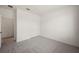 Clean bedroom with neutral carpeting, white walls, and closet, that offers a simple, uncluttered space at 24041 Peppercorn Rd, Punta Gorda, FL 33955