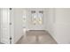 Bright entryway featuring tile flooring and glass paneled double doors providing an open feel at 24041 Peppercorn Rd, Punta Gorda, FL 33955