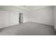 Main bedroom featuring carpeted floor and tray ceiling at 24041 Peppercorn Rd, Punta Gorda, FL 33955
