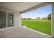 Covered patio boasts gorgeous backyard views of the lush, green landscape at 24041 Peppercorn Rd, Punta Gorda, FL 33955
