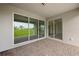 Covered patio with large sliding glass doors allowing an abundance of natural light at 24041 Peppercorn Rd, Punta Gorda, FL 33955