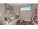 Comfortable office space with sofa, desk, and natural lighting at 29513 Velletri Ln, Wesley Chapel, FL 33543