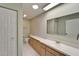 Large bathroom features cabinets, drawers, a toilet, and a sink with a wide mirror at 312 Fairside Ct # 12, Sun City Center, FL 33573