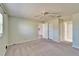 Bright bedroom boasts neutral carpet, ceiling fan, and closet access for optimal storage at 312 Fairside Ct # 12, Sun City Center, FL 33573