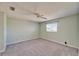 Spacious bedroom features neutral carpet, ceiling fan, and a window for ample natural light at 312 Fairside Ct # 12, Sun City Center, FL 33573
