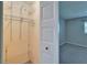 Walk-in closet features adjustable shelving for organized storage of clothing and accessories at 312 Fairside Ct # 12, Sun City Center, FL 33573