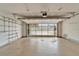 Spacious two car garage featuring neutral walls and storage shelves along left side at 312 Fairside Ct # 12, Sun City Center, FL 33573