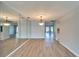 Open living room with light hardwood floors, neutral walls, and plenty of natural light at 312 Fairside Ct # 12, Sun City Center, FL 33573