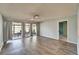 Bright living room featuring light hardwood floors, neutral walls, and screened-in porch access at 312 Fairside Ct # 12, Sun City Center, FL 33573