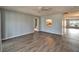 Comfortable living room with hardwood floors and easy access to the bathroom and kitchen at 312 Fairside Ct # 12, Sun City Center, FL 33573