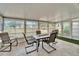 Bright sunroom with tile flooring, a table and chairs, plus multiple windows at 312 Fairside Ct # 12, Sun City Center, FL 33573
