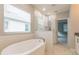 Luxury bathroom with soaking tub, glass-enclosed shower, and white subway tile at 324 37Th Ne Ave, St Petersburg, FL 33704