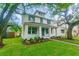 Charming two-story home with landscaped yard and welcoming front porch at 324 37Th Ne Ave, St Petersburg, FL 33704