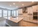 Modern kitchen with white cabinets, stainless steel appliances, and central island at 324 37Th Ne Ave, St Petersburg, FL 33704