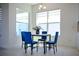 Cozy dining area with a modern table set and ample natural light, ideal for casual meals and gatherings at 32768 Tree Of Life Ave, Wesley Chapel, FL 33543