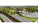 Overhead view of the community entrance featuring lush landscaping, water features, and a welcoming entryway at 32768 Tree Of Life Ave, Wesley Chapel, FL 33543