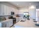 Bright kitchen showcasing white cabinetry, stainless steel appliances, and a spacious countertop perfect for meal preparation at 32768 Tree Of Life Ave, Wesley Chapel, FL 33543