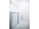 Clean, minimalist laundry room features modern appliances and ample space at 32768 Tree Of Life Ave, Wesley Chapel, FL 33543