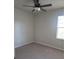 Comfortable bedroom featuring plush carpeting, a ceiling fan, and a bright window for a peaceful retreat at 3312 Lila St, Tampa, FL 33610