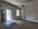 Inviting living room with ample natural light, sleek hardwood floors, and a welcoming atmosphere at 3312 Lila St, Tampa, FL 33610
