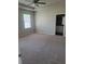 Spacious Primary bedroom with large windows, plush carpeting, and an ensuite bathroom, perfect for unwinding at 3312 Lila St, Tampa, FL 33610