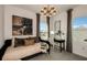 Relaxing bedroom features a daybed, a chandelier, and a tranquil view from the windows at 37368 Gunnison Dr, Zephyrhills, FL 33540