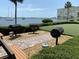 Outdoor grilling area with multiple grills and views of the bay at 4550 Cove Cir # 407, St Petersburg, FL 33708