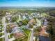 Aerial view of the neighborhood showing the abundance of mature trees and landscaping at 4859 Augusta Ave, Oldsmar, FL 34677