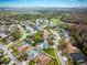 Sprawling community with mature trees, lush lawns, and well-maintained homes offers a welcoming neighborhood setting at 4859 Augusta Ave, Oldsmar, FL 34677
