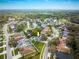 Desirable neighborhood featuring a lovely home, lush greenery, and close proximity to the golf course in aerial view at 4859 Augusta Ave, Oldsmar, FL 34677