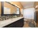 Bathroom featuring double sinks, granite countertops, and tiled backsplash and shower at 4859 Augusta Ave, Oldsmar, FL 34677