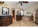 Luxurious bathroom boasting dual vanities, a soaking tub, a walk-in closet, and a tiled shower at 4859 Augusta Ave, Oldsmar, FL 34677