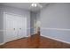 Bedroom with hardwood floors, large closet, neutral paint and ceiling fan at 4859 Augusta Ave, Oldsmar, FL 34677