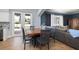 Open concept dining area with backyard access and views of the living room at 4859 Augusta Ave, Oldsmar, FL 34677