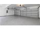 Expansive three-car garage with durable epoxy flooring and automatic door openers at 4859 Augusta Ave, Oldsmar, FL 34677