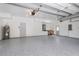 Spacious garage featuring epoxy flooring, ample lighting, and plenty of room for storage and work space at 4859 Augusta Ave, Oldsmar, FL 34677