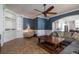 Comfortable living room with built-in shelving, a ceiling fan and a comfortable L-shaped couch at 4859 Augusta Ave, Oldsmar, FL 34677