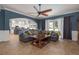 Open concept living room with backyard access, tile floors, and blue accent wall at 4859 Augusta Ave, Oldsmar, FL 34677