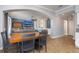 Open concept dining and living area with blue accent wall and tile floors at 4859 Augusta Ave, Oldsmar, FL 34677