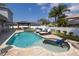 Resort-style pool with lounge chairs, gazebo, and privacy landscaping at 4859 Augusta Ave, Oldsmar, FL 34677